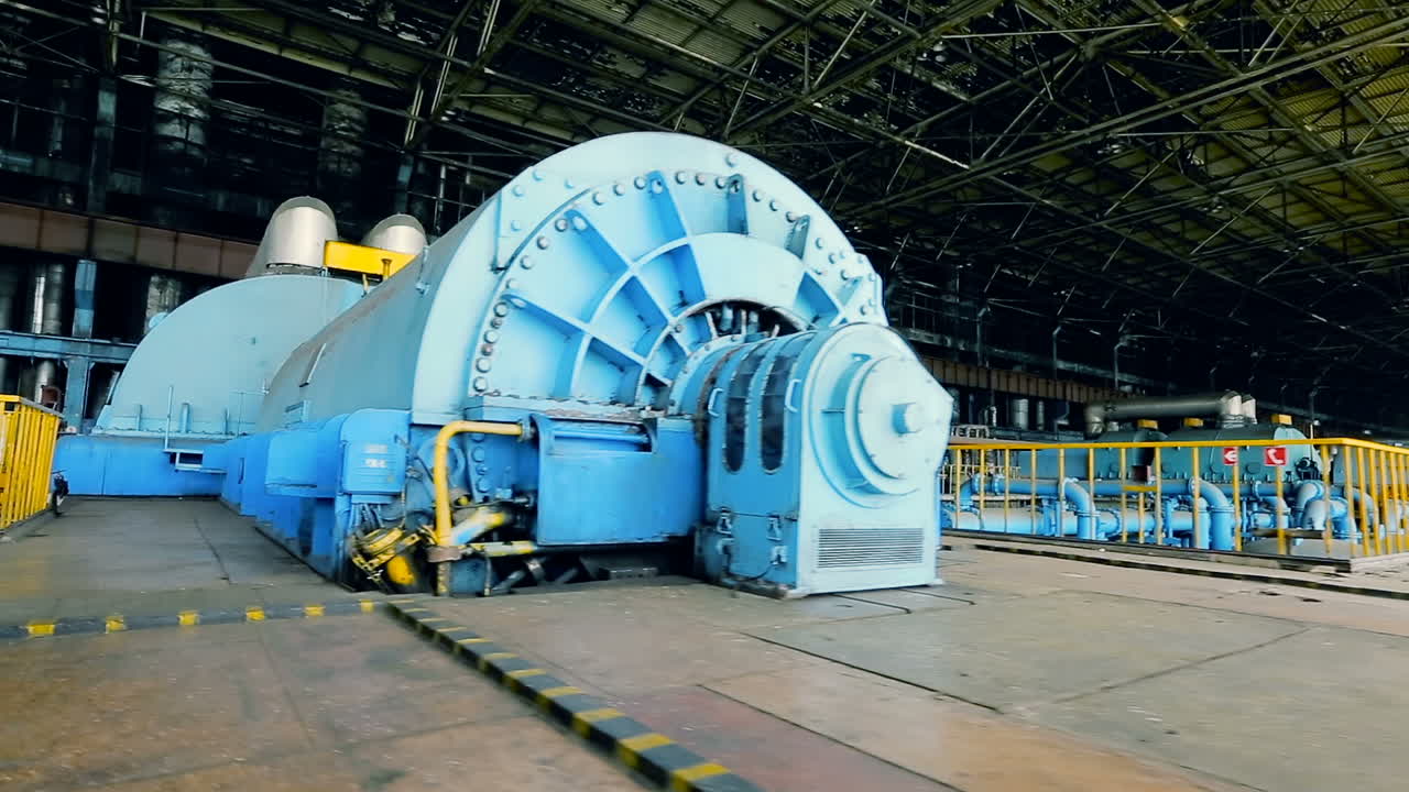 Steam turbine of power plant. Powerful turbine in the steam turbine hall