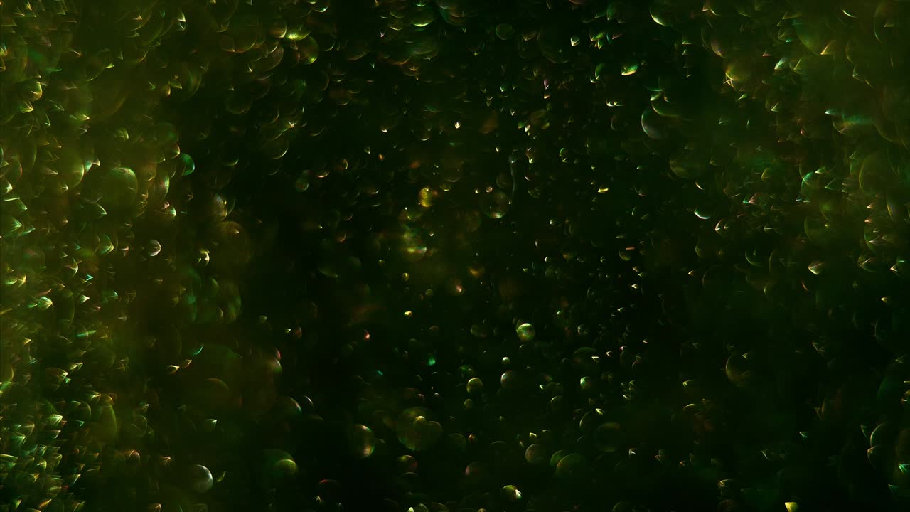 chispas doradas mágicas dando vueltas, girando, moviéndose al azar en el fondo gris y negro.