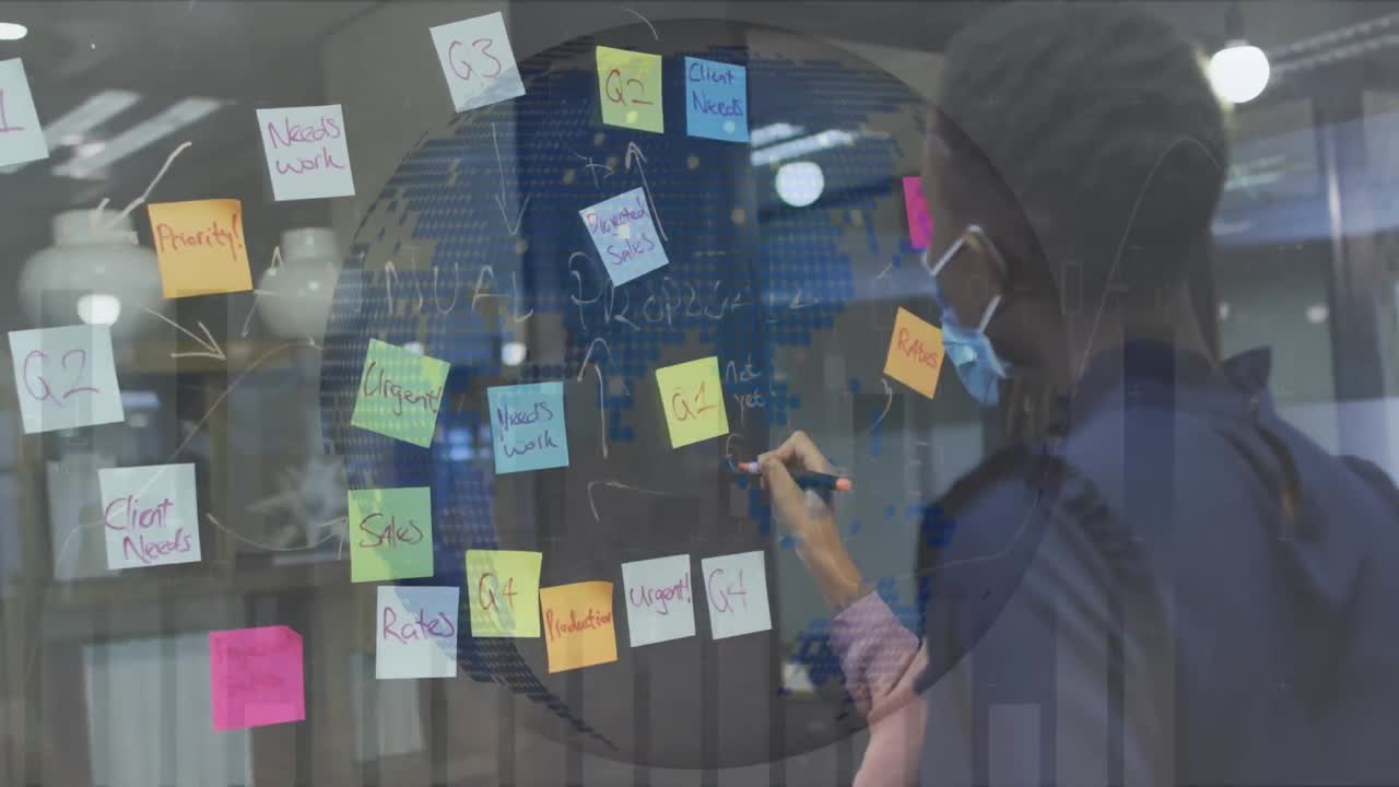 Animation of financial data processing over diverse businesswomen with face masks taking notes