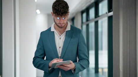 man using tablet in a modern office