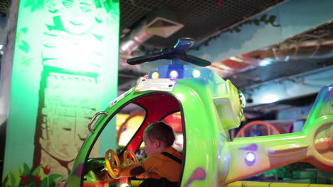 boy in amusement helicopter