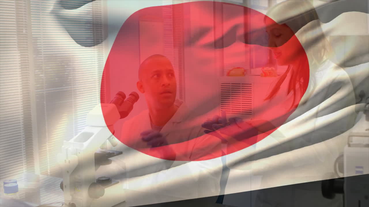 In lab, scientists discussing research using microscope with animation overlay