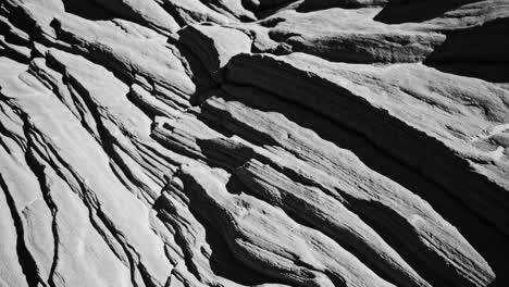 textured layers of ancient rock in black and white