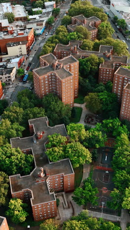 New York city housing projects to go green. Unusual design of the residential buildings with lots of greenery around. Top view. Vertical video