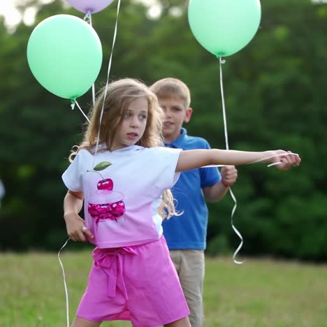 children playing with balloons