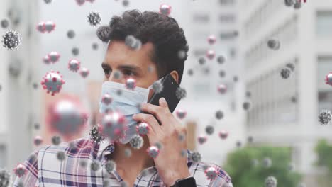 animation of virus cells over latin man wearing face mask in street