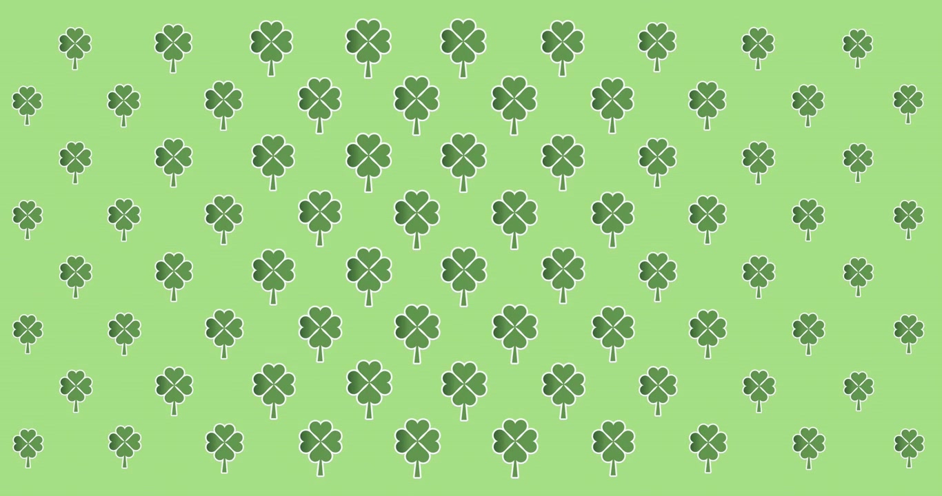 Animazione digitale di molteplici foglie di trifoglio che si muovono su sfondo verde.