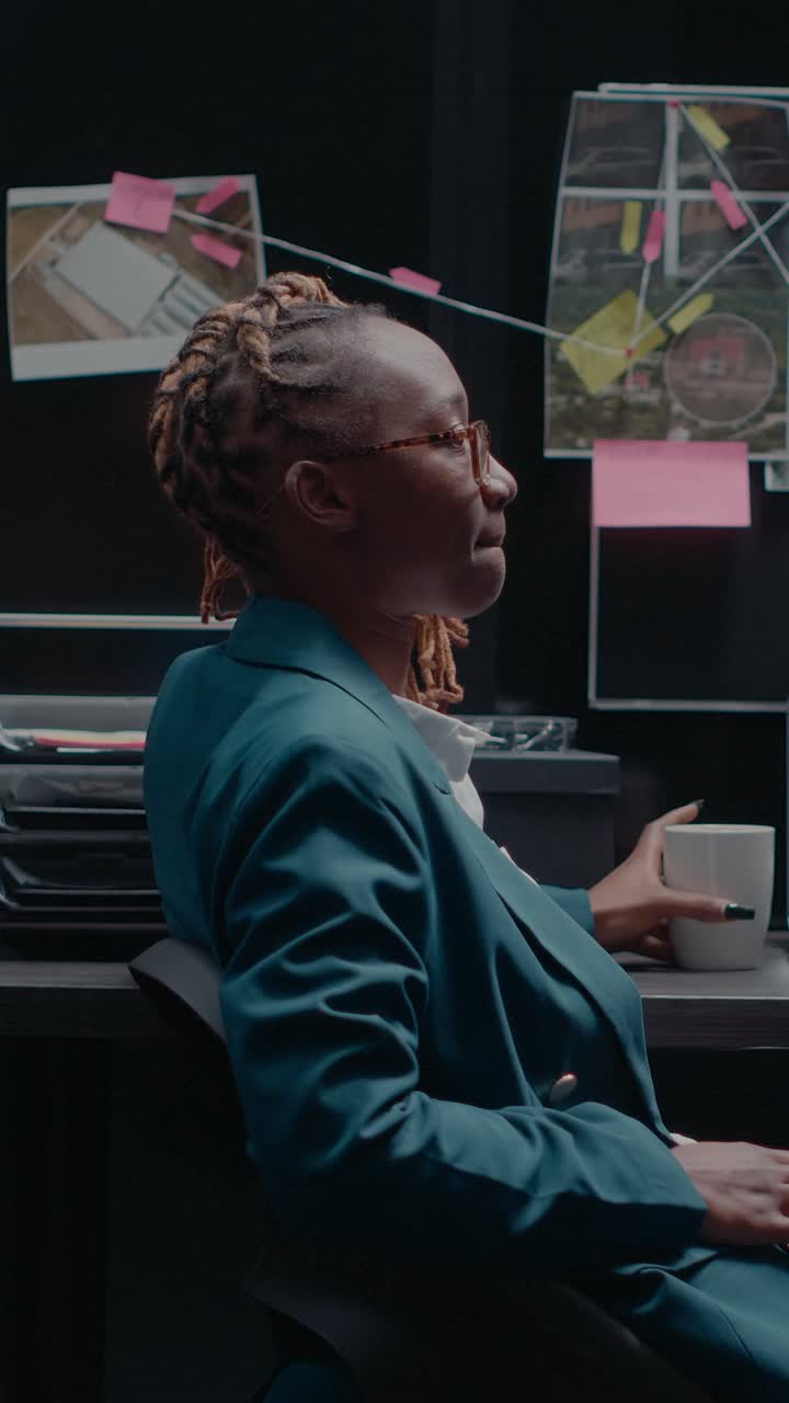 Vertical video: African american woman analyzing case records