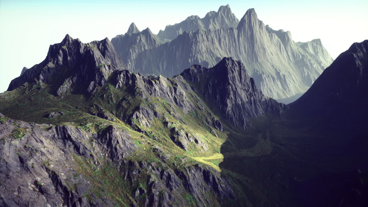 Majestic mountains rising in early morning light with rugged terrain