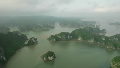 Aerial-view-of-an-islands-located-in-Ha-Long-Bay,-Vietnam,-showcasing-its-stunning-natural-landscape-and-unique-features