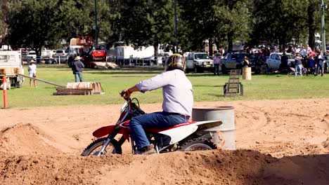 rider performs stunts on a dirt track