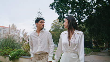 romantic couple walking stairs outdoors. hispanic pair enjoying date at nature