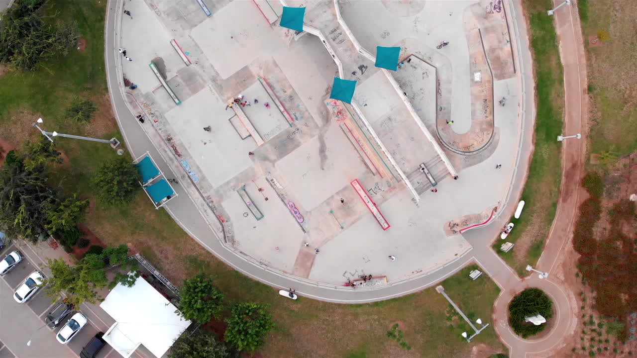 Drone footage Above Skatepark with People Skating