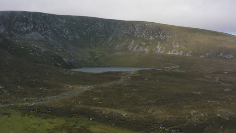 Aerial-reveal-of-a-mountain-lake