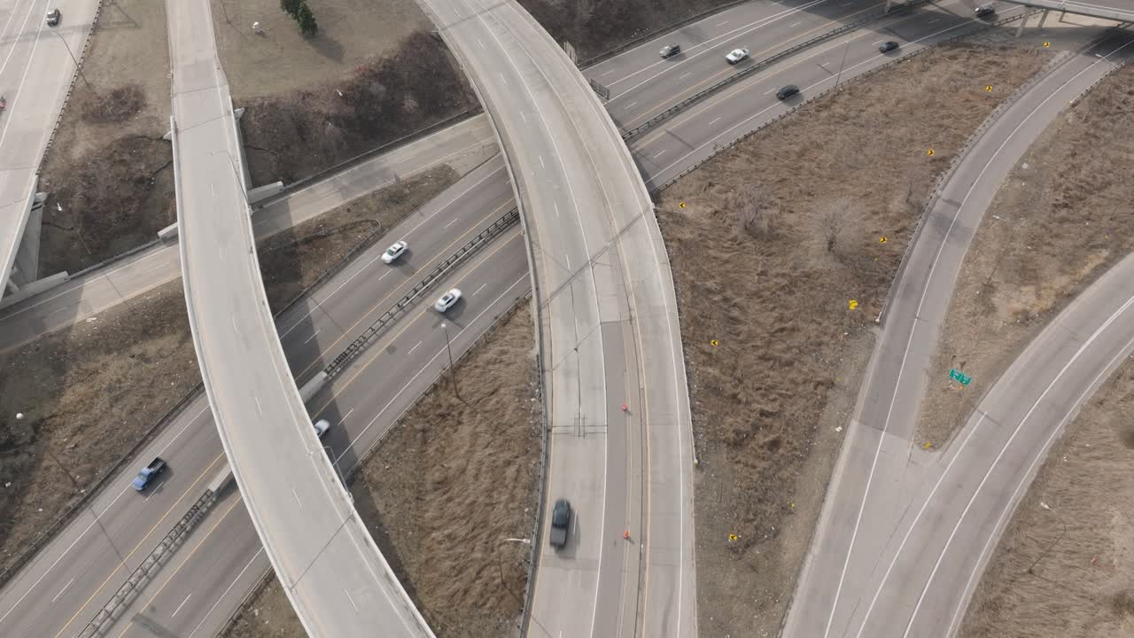 Overhead drone view of freeway overpasses with traffic in Minneapolis.