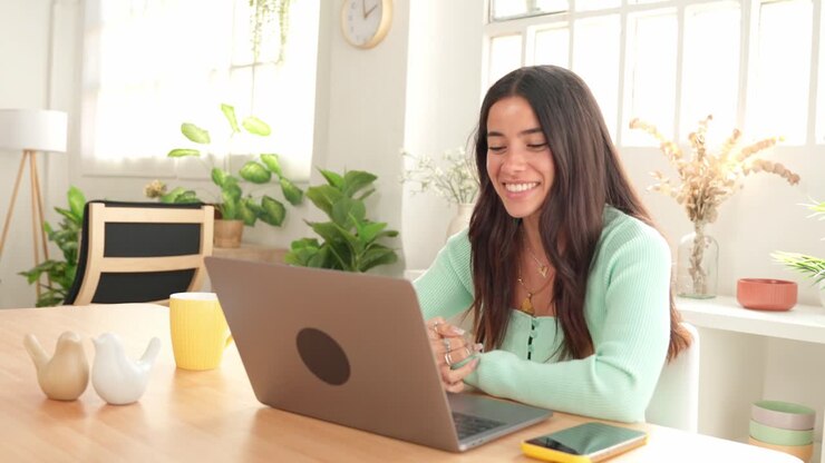 A woman working at home on her laptop
