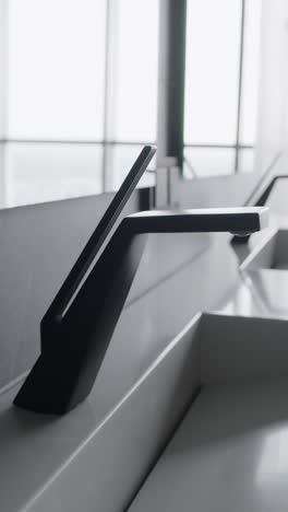 modern black faucet on grey countertop