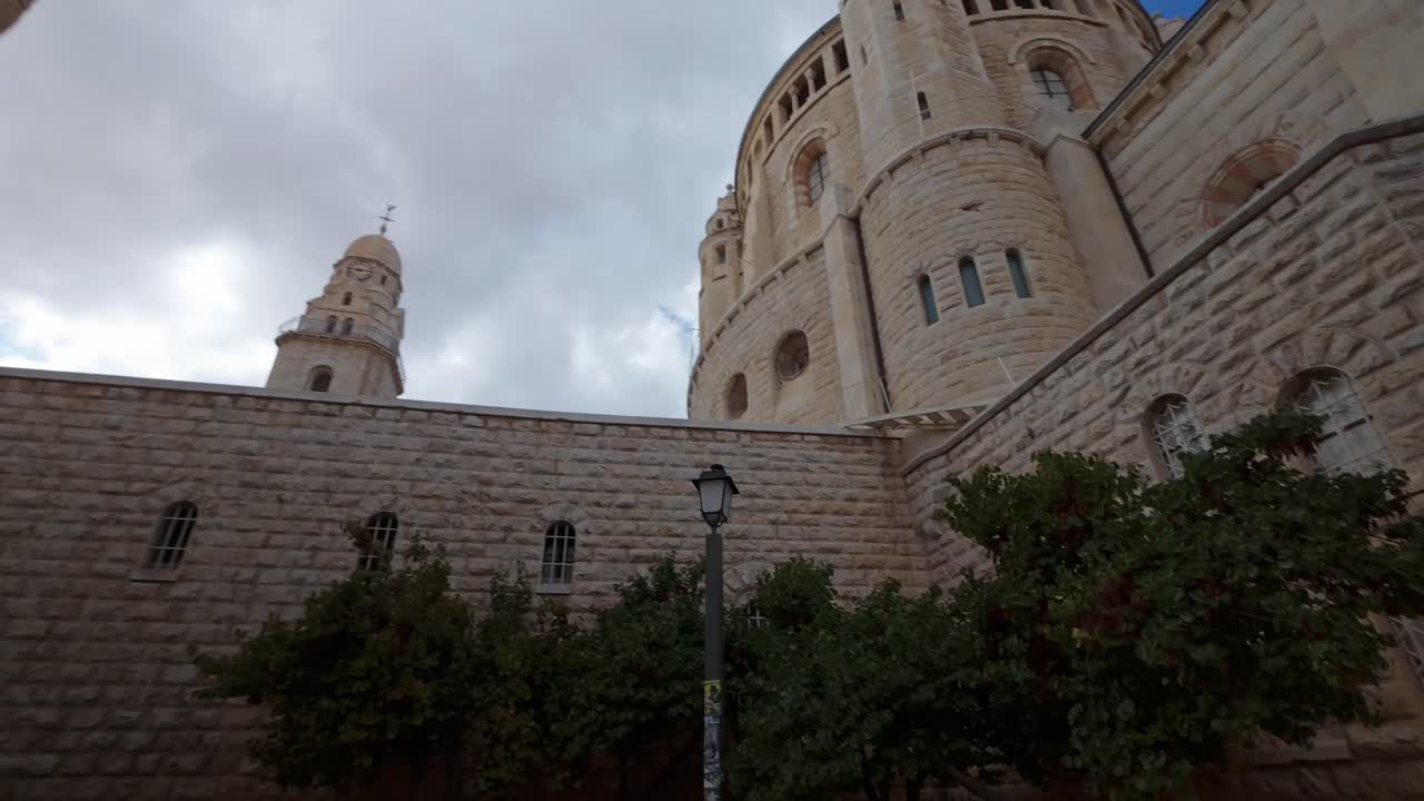 Dynamic hyperlapse shot of the stone tower of the Dormition Abbey in Old City Jerusalem, Israel
