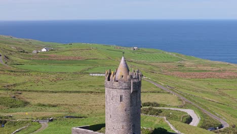 Round stone tower of Doonagore Castle near Doolin County Clare Ireland sunny coast
