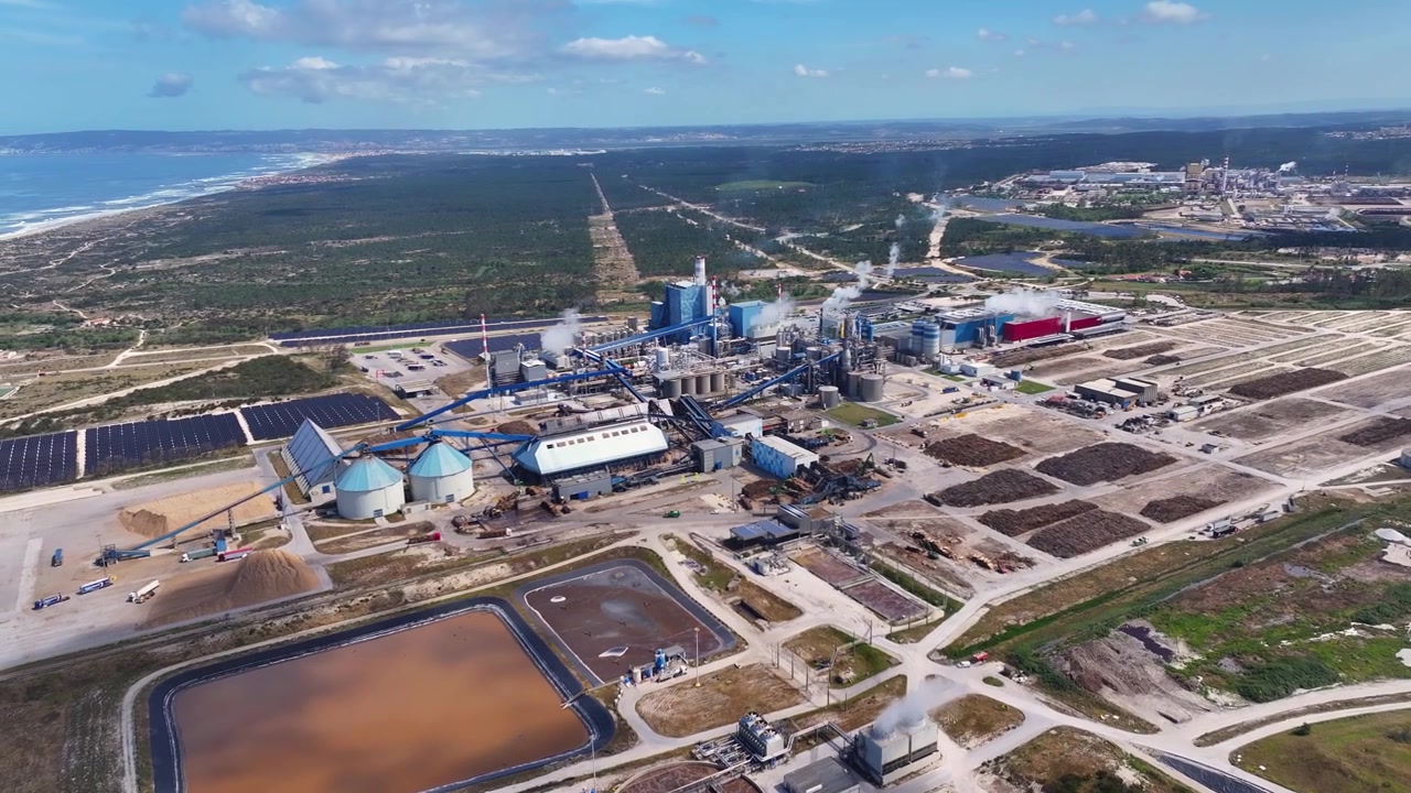 Expansive aerial view of a pulp and paper mill, showcasing the industrial facility for cellulose and bioenergy production from wood chips