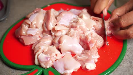 preparing chopped raw chicken