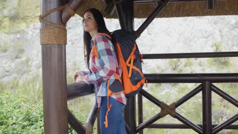 smiling backpacker on a mountain lookout