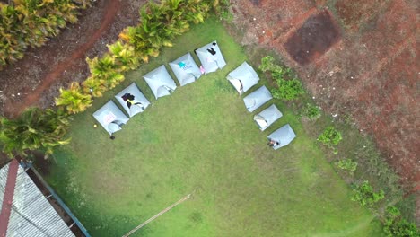 tent for camping on green field drone shot