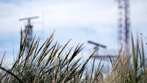 communication and radar tower of military base blurred in background