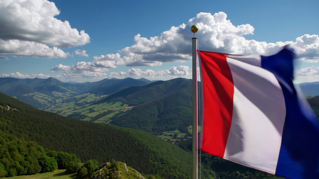 French Flag Waving Over Mountains
