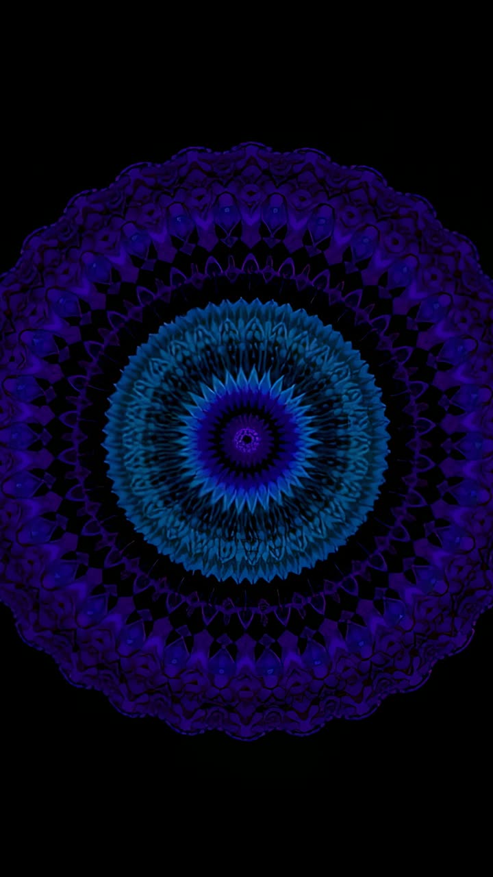 Video verticale: mandala caleidoscopico blu sfumato che pulsa e ruota nel vuoto nero, con anelli