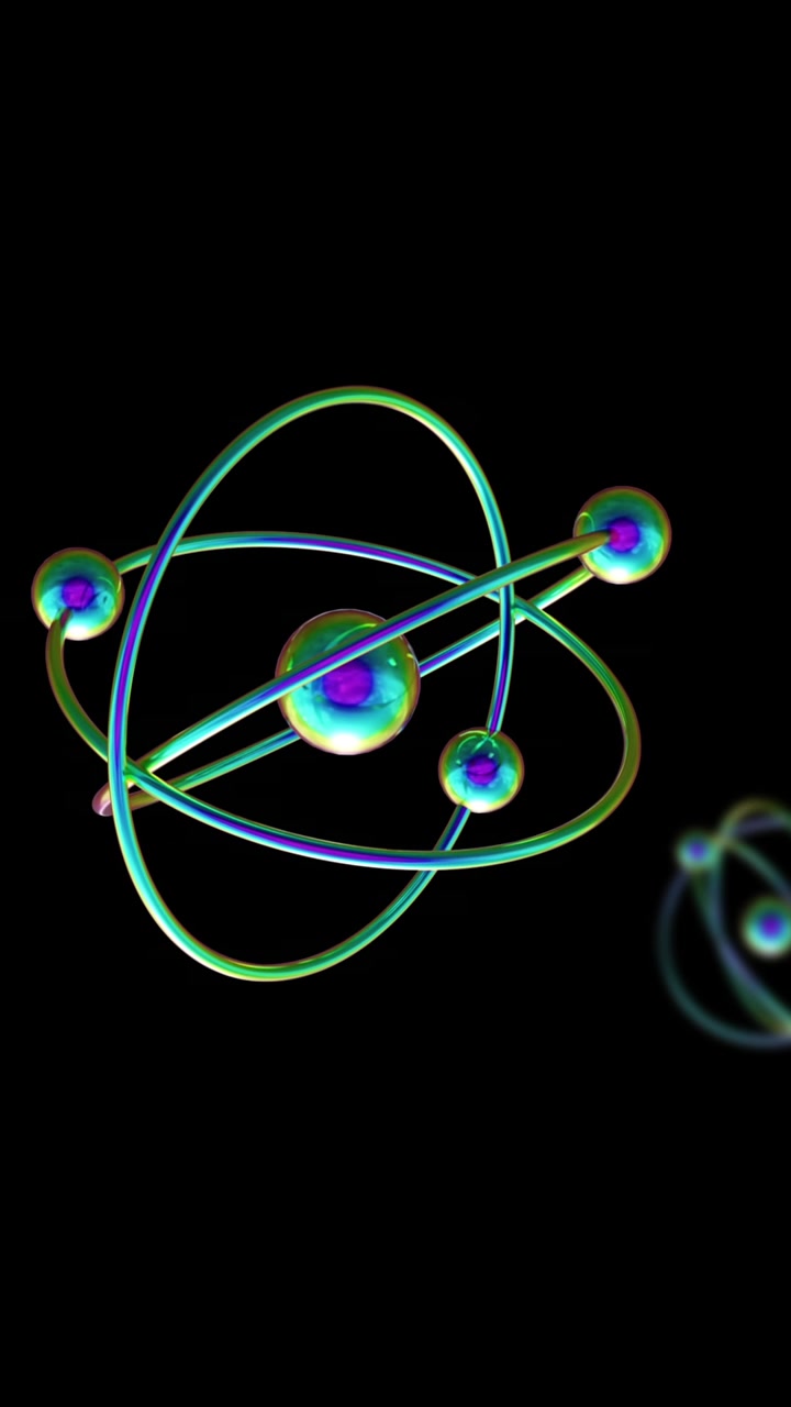 Animation of atom models spinning on black background