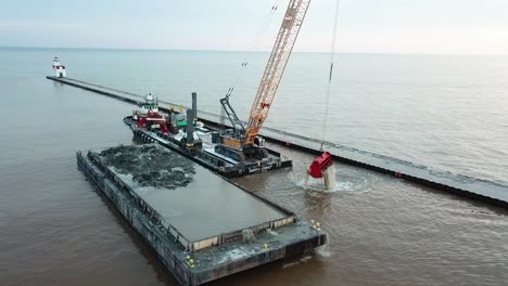 Dredging-operation-in-Kewaunee-Harbor-on-Lake-Michigan,-Kewaunee,-Wisconsin-5