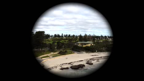 Spy-telescope-view-panning-of-Cottesloe-Beach,-Perth,-Western-Australia