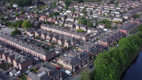 aerial view flying above wealthy cheshire real estate housing property zoom in to close up shot