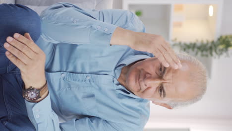 Vertical-video-of-Unhappy-and-restless-old-man.