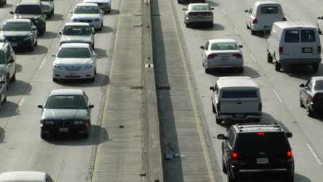 traffic moves slowly along a busy freeway in los angeles 12