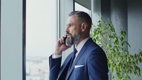 businessman talking on phone in office