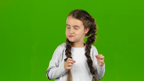 child making faces on green screen