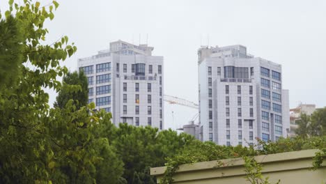 A-view-of-twin-towers-over-the-trees-at-Valencia,-Spain