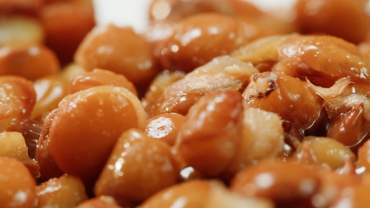 Lentils macro, Open metal can with preserved steamed brown lentils close up isolated on white background