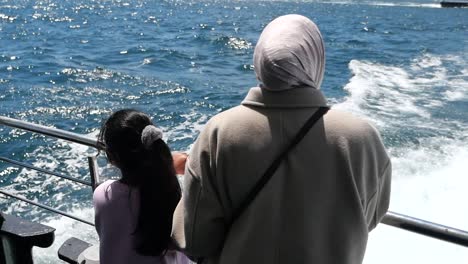 mother and daughter on a ferry boat