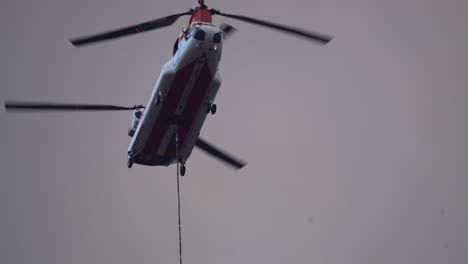 firefighting chinook helicopter battling forest fire