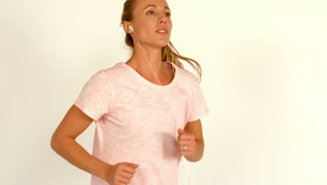 female athlete running on a white background