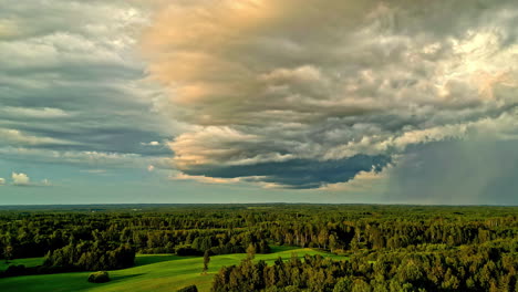 wonderful landscape of clouds moving in the sky over a lush forest with time lapses