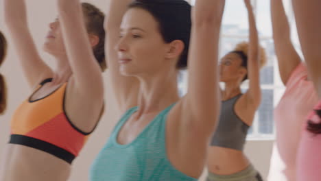 yoga-class-of-young-multiracial-people-practicing-warrior-pose-enjoying-healthy-lifestyle-exercising-in-fitness-studio-training-posture