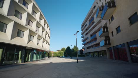 residential buildings in vimercate, establishing tilt down shot, empty street