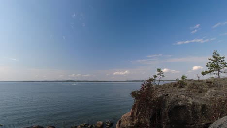 Time-lapse-of-boats-motoring-on-blue-ocean-bay-on-bright-sunny-day