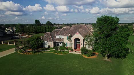 large suburban home with lush landscaping