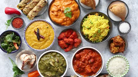 Assorted-Indian-various-food-with-spices--rice-and-fresh-vegetables