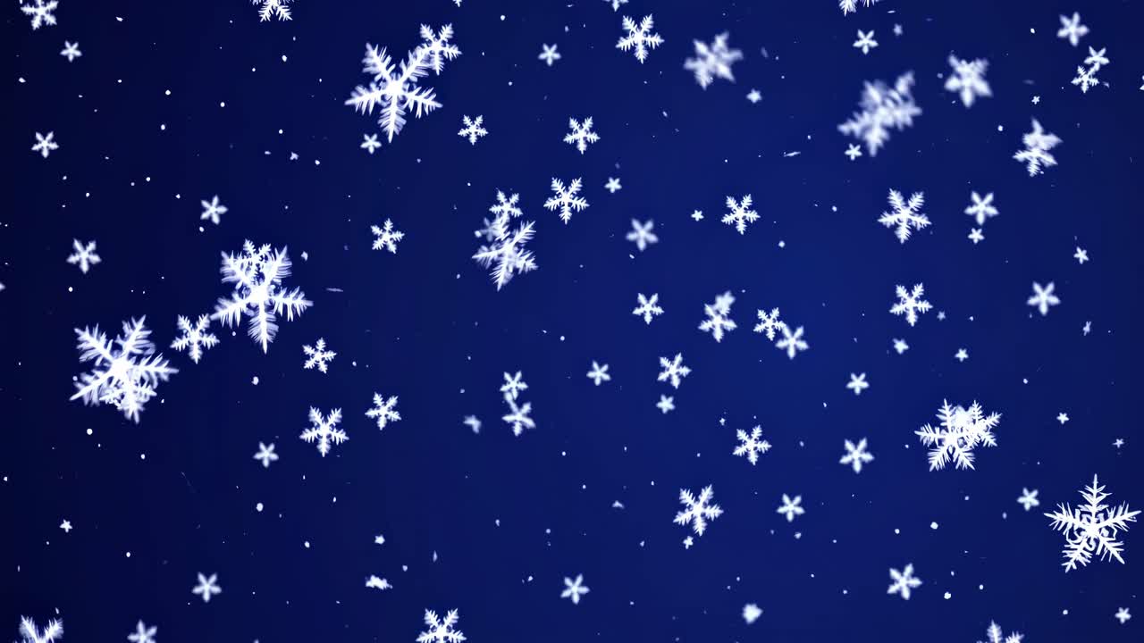 Aerial view of delicate snowflakes falling against a deep blue background, creating a serene winter